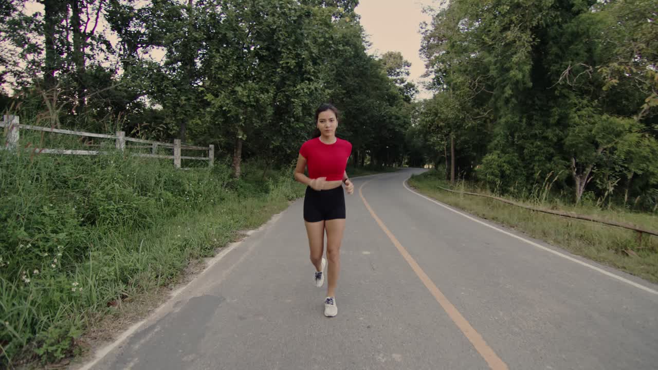 Woman Running on a Country Road