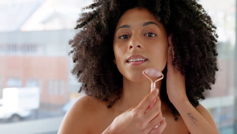 Face-roller,-skincare-and-black-woman-doing