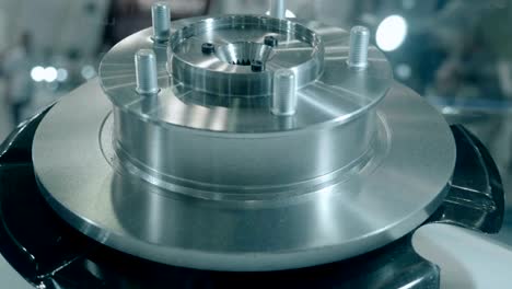 new brake disc is shiny in the light is presented for review at the exhibition