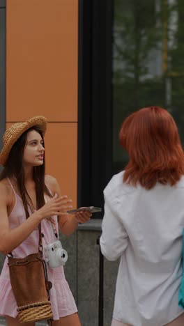 two women talking on the street