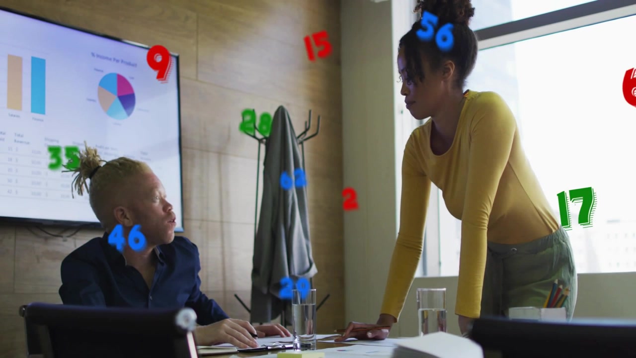 Woman leaning gesturing over papers in business meeting, man reacting as data floating over charts