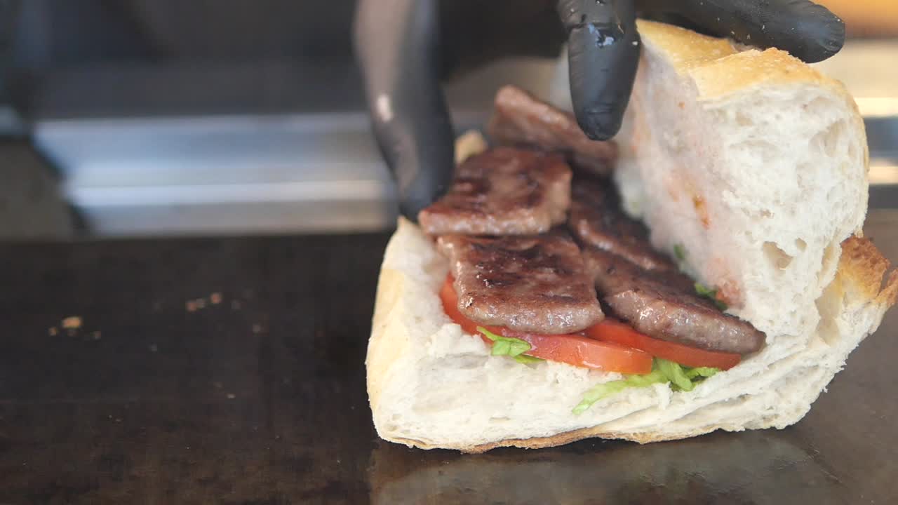 Meat sandwich with tomato and lettuce