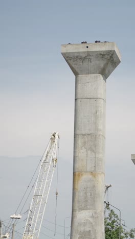 Construction Site with Scaffolding and Cranes