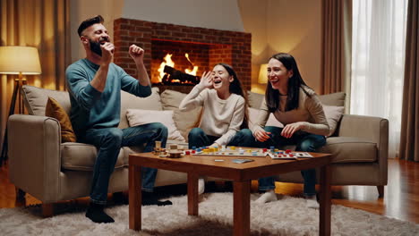 family having fun playing board games at home