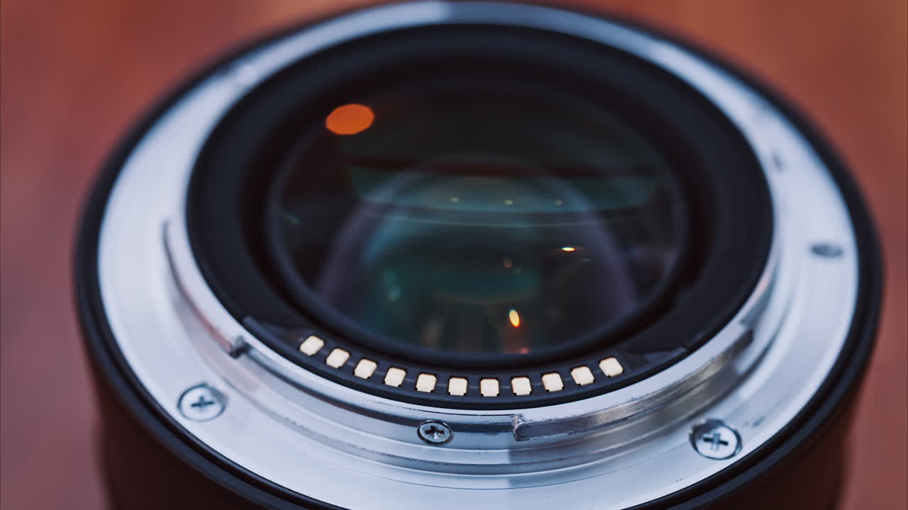Close up of a camera lens on a wooden table