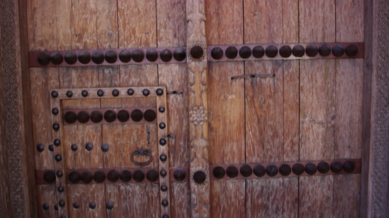 Jabreen Castle wooden door with studs, Oman, static medium shot