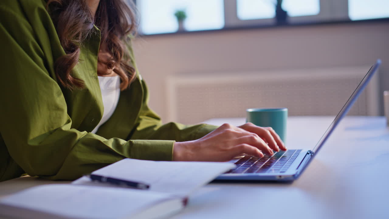 Woman working on a laptop in an office