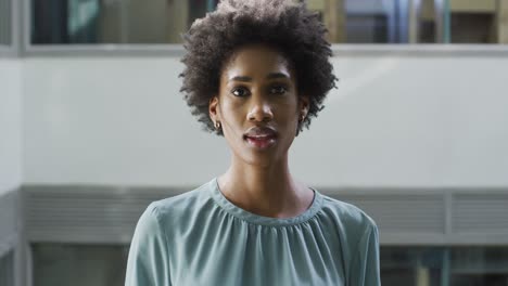 video of happy african american businesswoman looking at camera