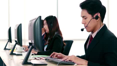 Business-people-wearing-headset-working-in-office