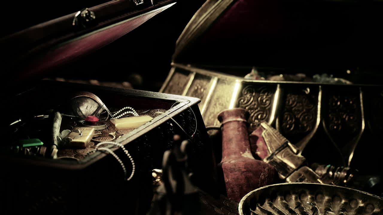 어 ⁇  속에서 보석과 금 동전을