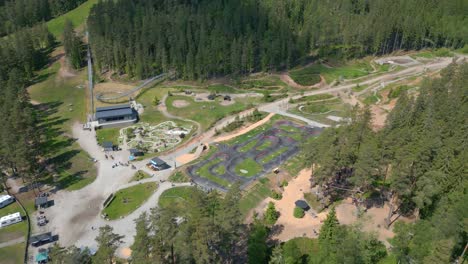aerial fly over of isaberg mountain resort in sweden showing mini golf course and pump track