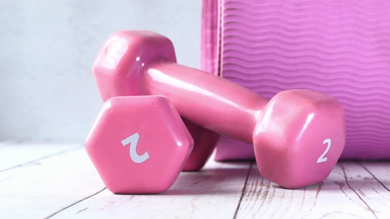 Pink Dumbbells and Exercise Mat