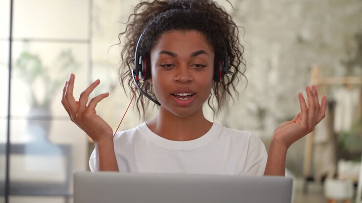 Portrait of young black woman having a video call. Girl teleworking.