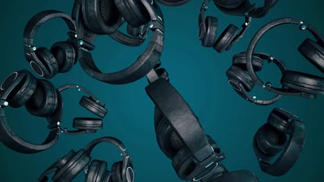 black headphones falling through teal space