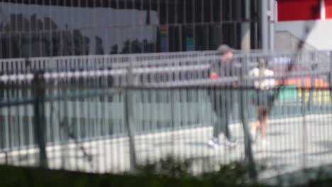 three friends walking together in urban setting