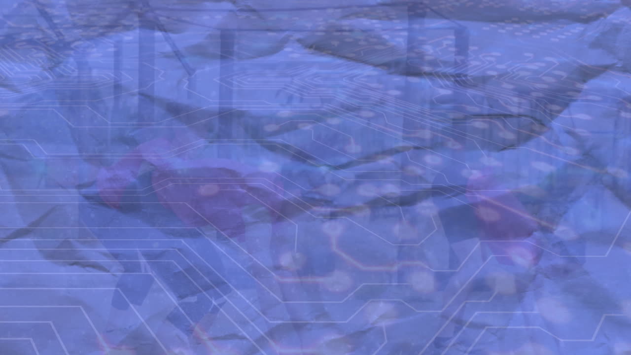 Animation of abstract circuitry pattern overlaying urban landscape with blue tones