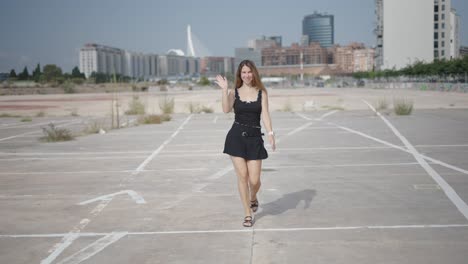 woman walking in urban parking lot