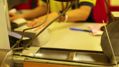 person purchasing ticket at mtr counter