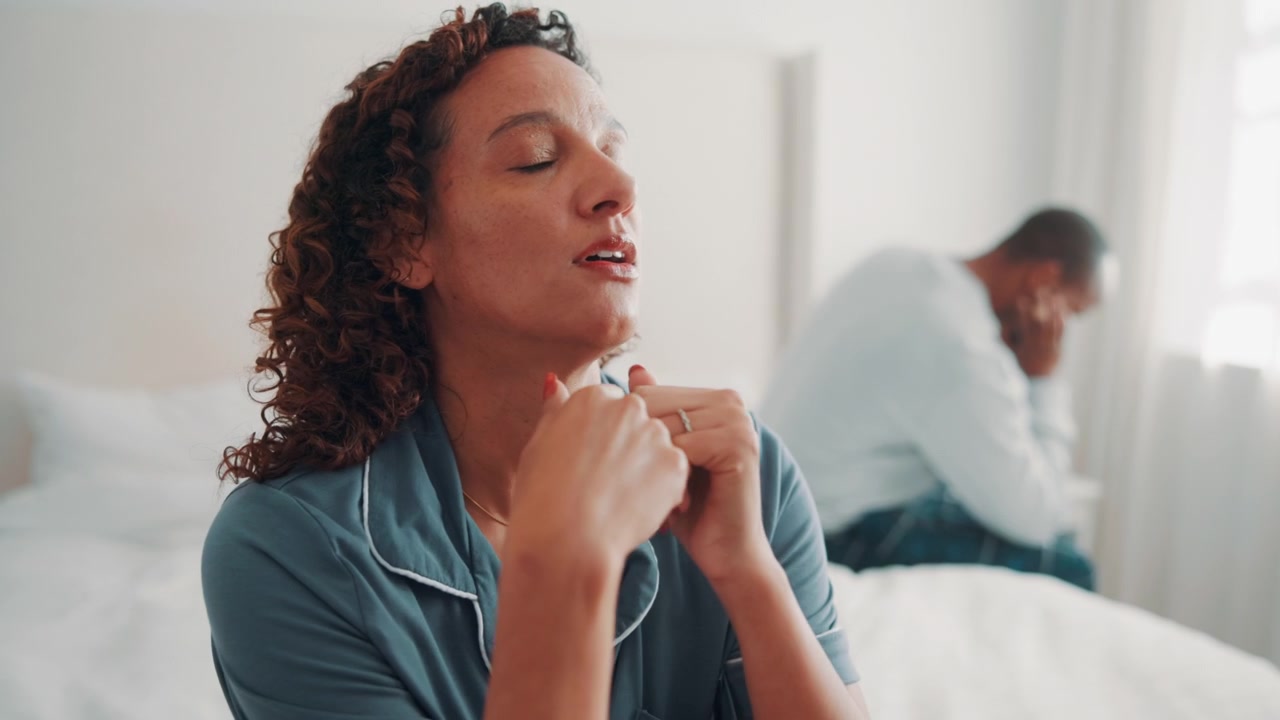 Stressed Couple Having Relationship Problems in Bedroom