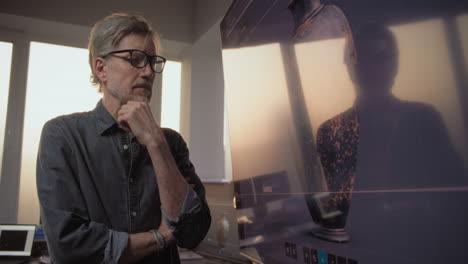 expert examining ancient pottery on a computer screen