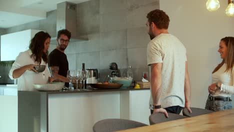 happy young couple preparing dinner for friends