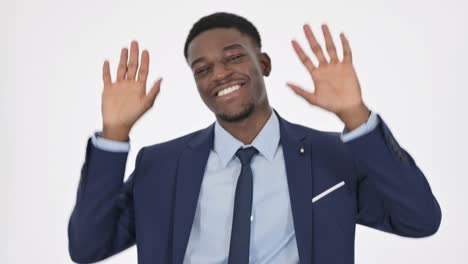 african businessman dancing in joy on white background