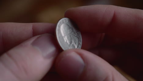 Fingers-Flipping-A-Quarter-Dollar-Coin-In-Hand