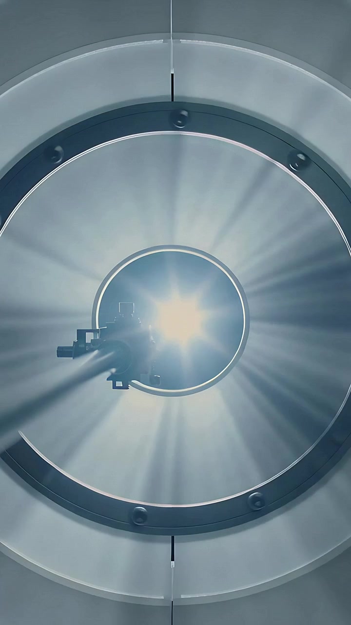 Vertical video: Powering lamp, probe mount casting shadow as light flaring then dimming in chamber