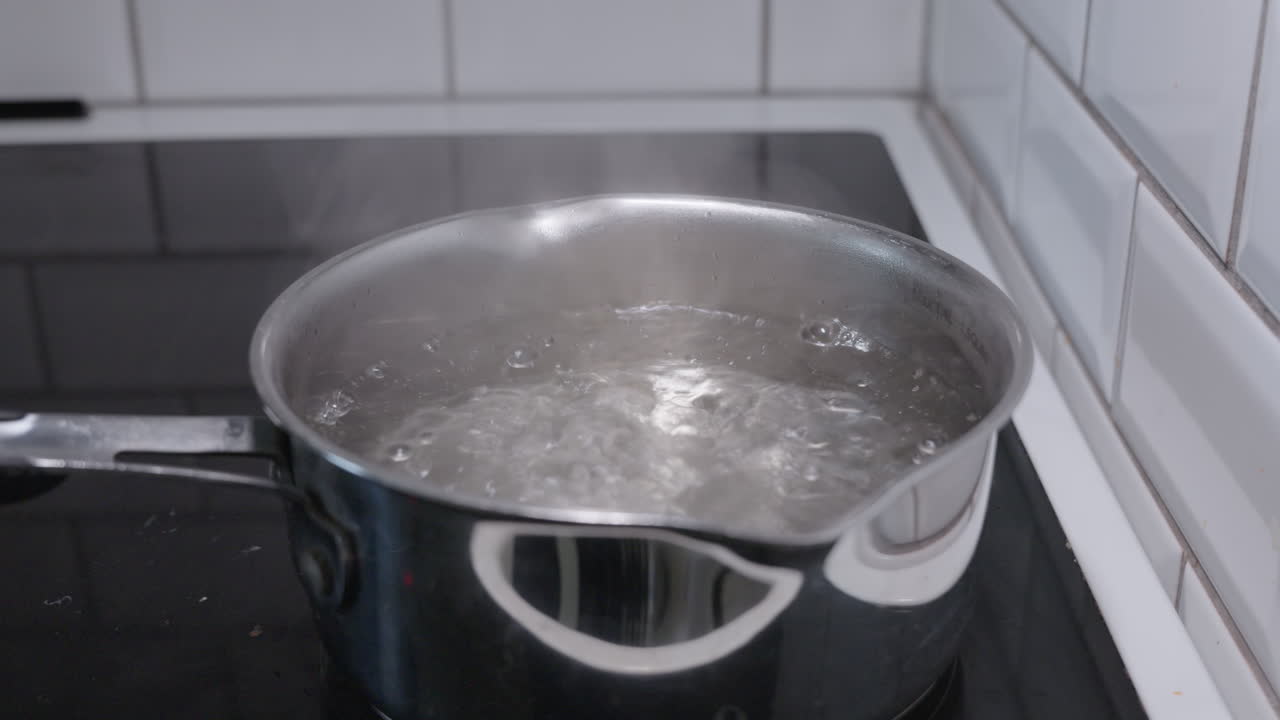 Slow motion shot of a pot with boiling water