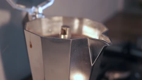 close-up of italian coffee maker moka pot brewing rich coffee