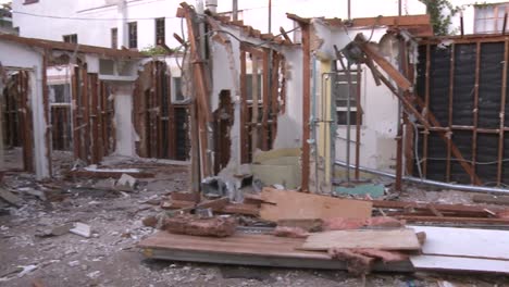 pan right to left inside a house in the process of being demolished