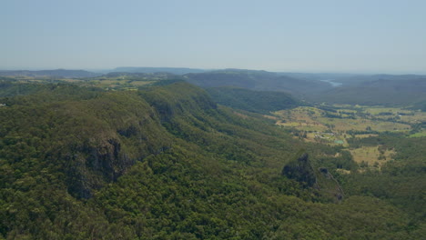 high level drone scenic view over binna burra mountain treetops, slow motion 4k, queensland australia