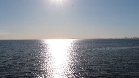 sunset reflecting on calm ocean waters