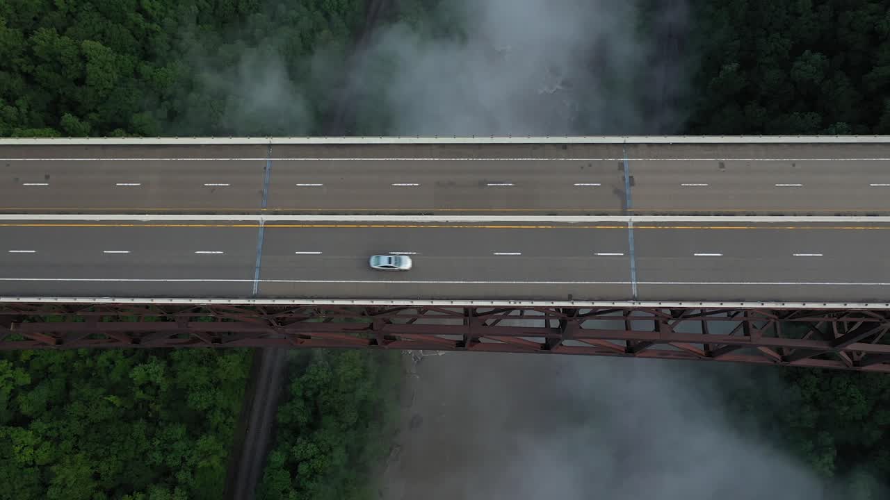 Aerial View of Cars on Bridge Above New River Gorge, West Virginia USA. Birdeye Descening Drone Shot