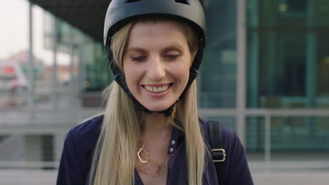 attractive young blonde woman portrait of cute business intern posing thumb up wearing safety helmet in city