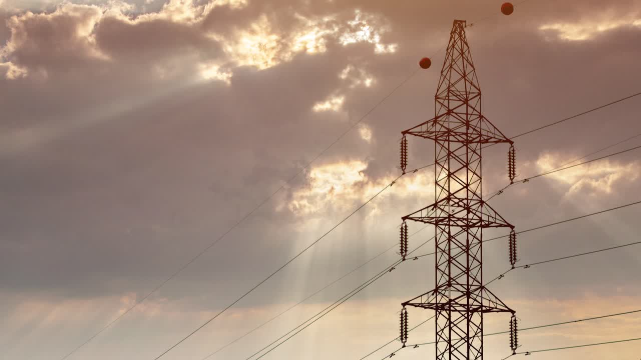High voltage transmission tower against dramatic cloudy sky, electricity pylon time lapse footage, moving clouds and changing light conditions, power grid infrastructure and energy distribution
