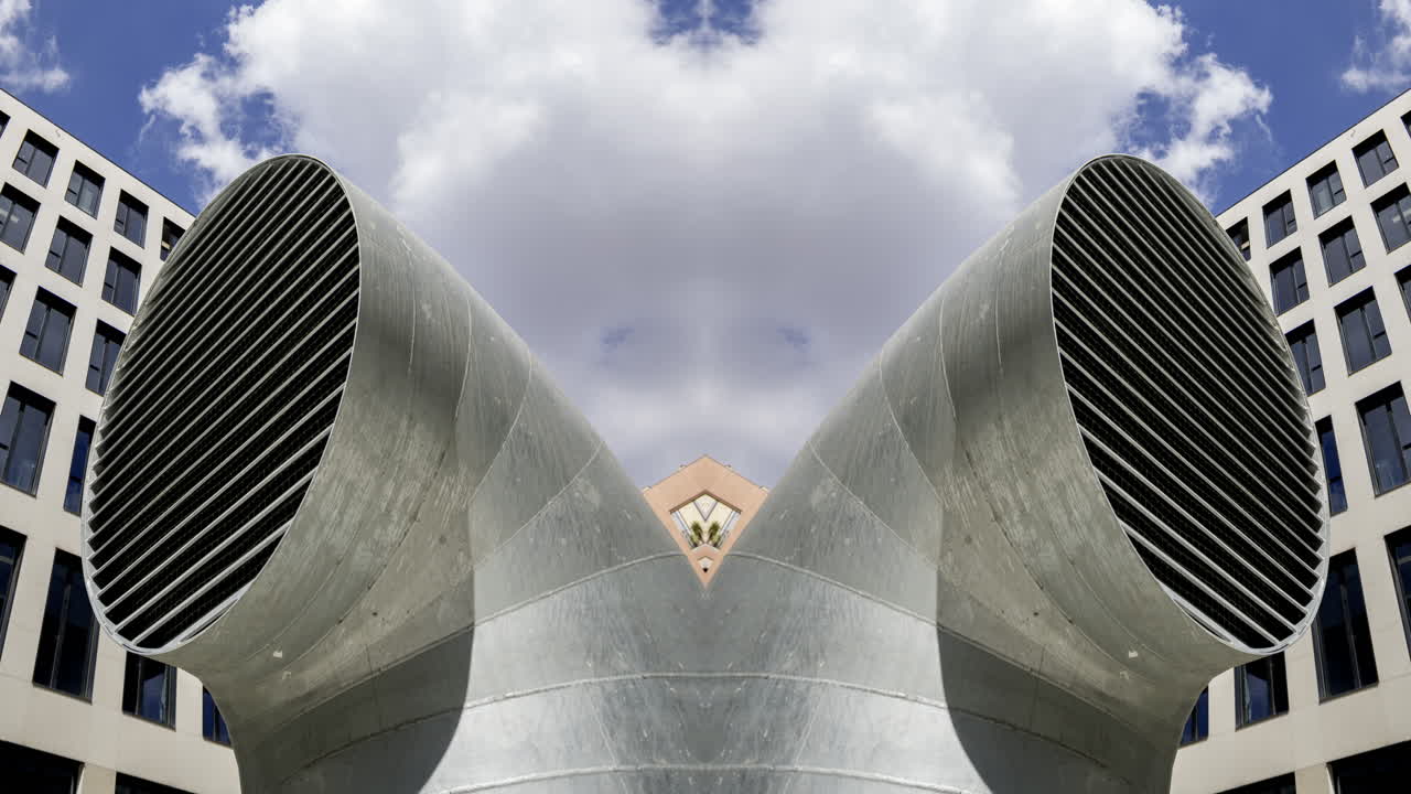 Old factory and industrial complex with passing clouds made into abstract pattern