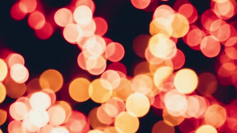 blurred christmas background and yellow bokeh defocus lights.