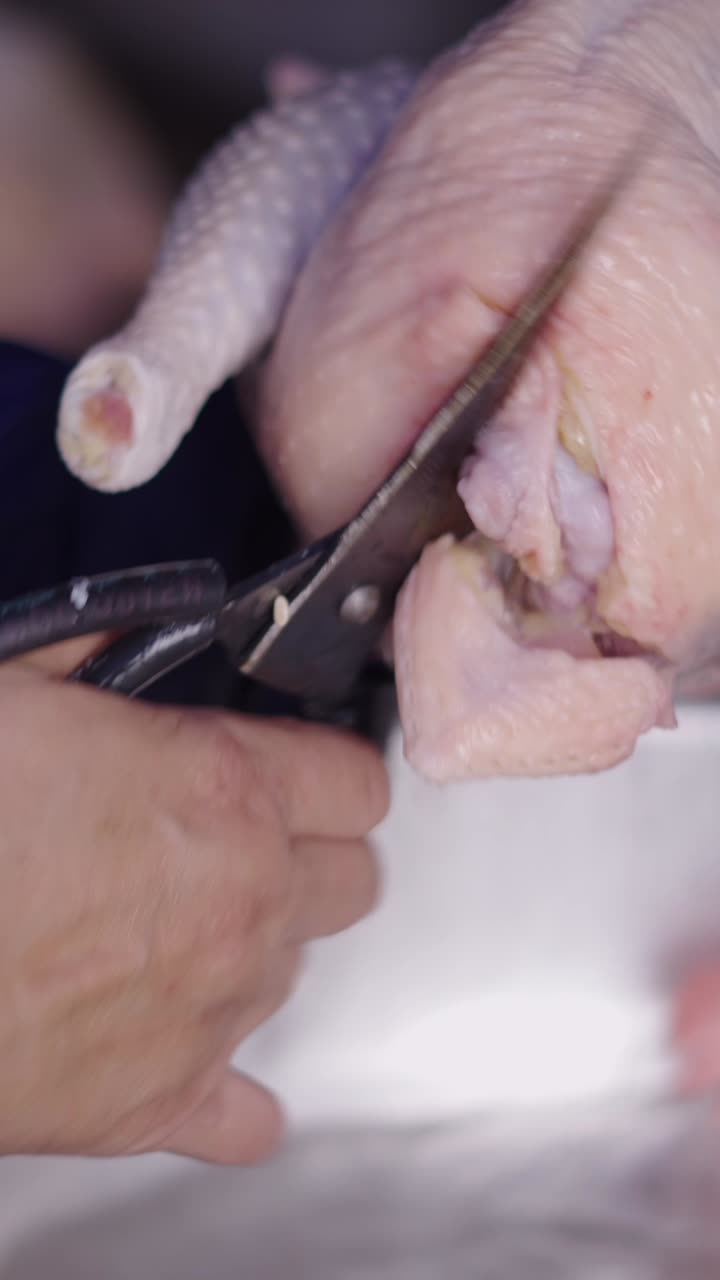 Preparing a raw chicken for cooking