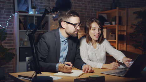 business partners collaborating late night