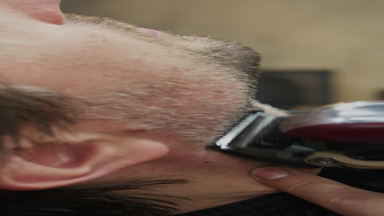 Middle-aged Man Having His Beard Shaved at Salon