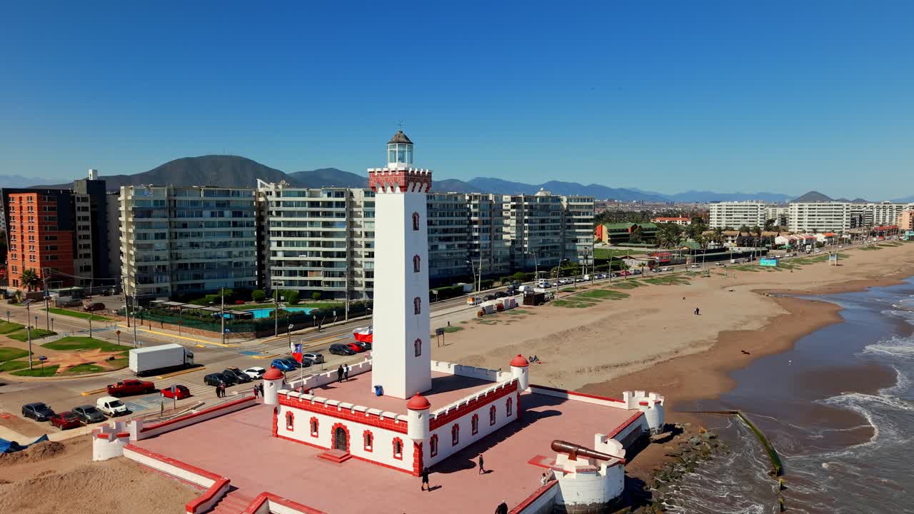 Scenic view of Faro de La Serena, overlooking ocean, streets, and nearby buildings