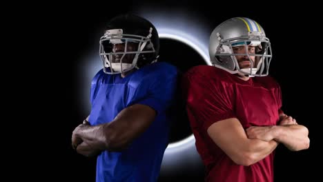 Animation-of-two-diverse-male-rugby-players-standing-against-glowing-ring-on-black-background