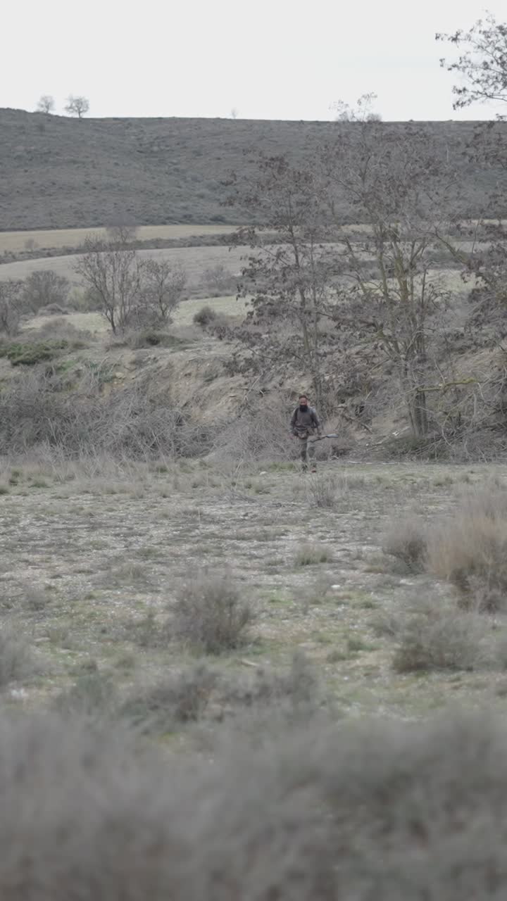 Hunter in a rural landscape
