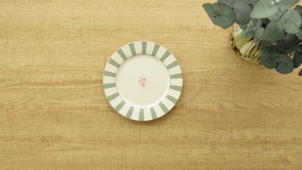 Overhead shot of a plate on a wooden table
