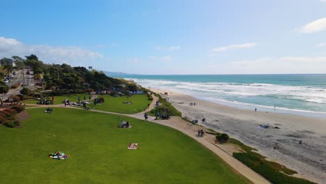 people relaxing at powerhouse park in del mar, san diego, california, united states