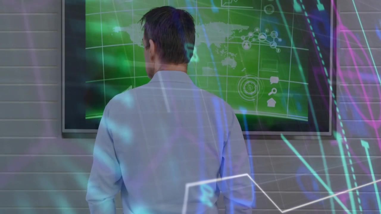 Man entering centering before monitor watching overlays showing green map analyzing business data
