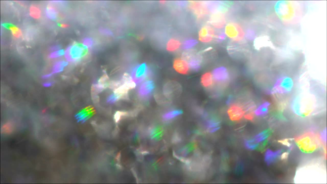 el fondo de las partículas brillantes de bokeh, la textura abstracta, el bucle plateado