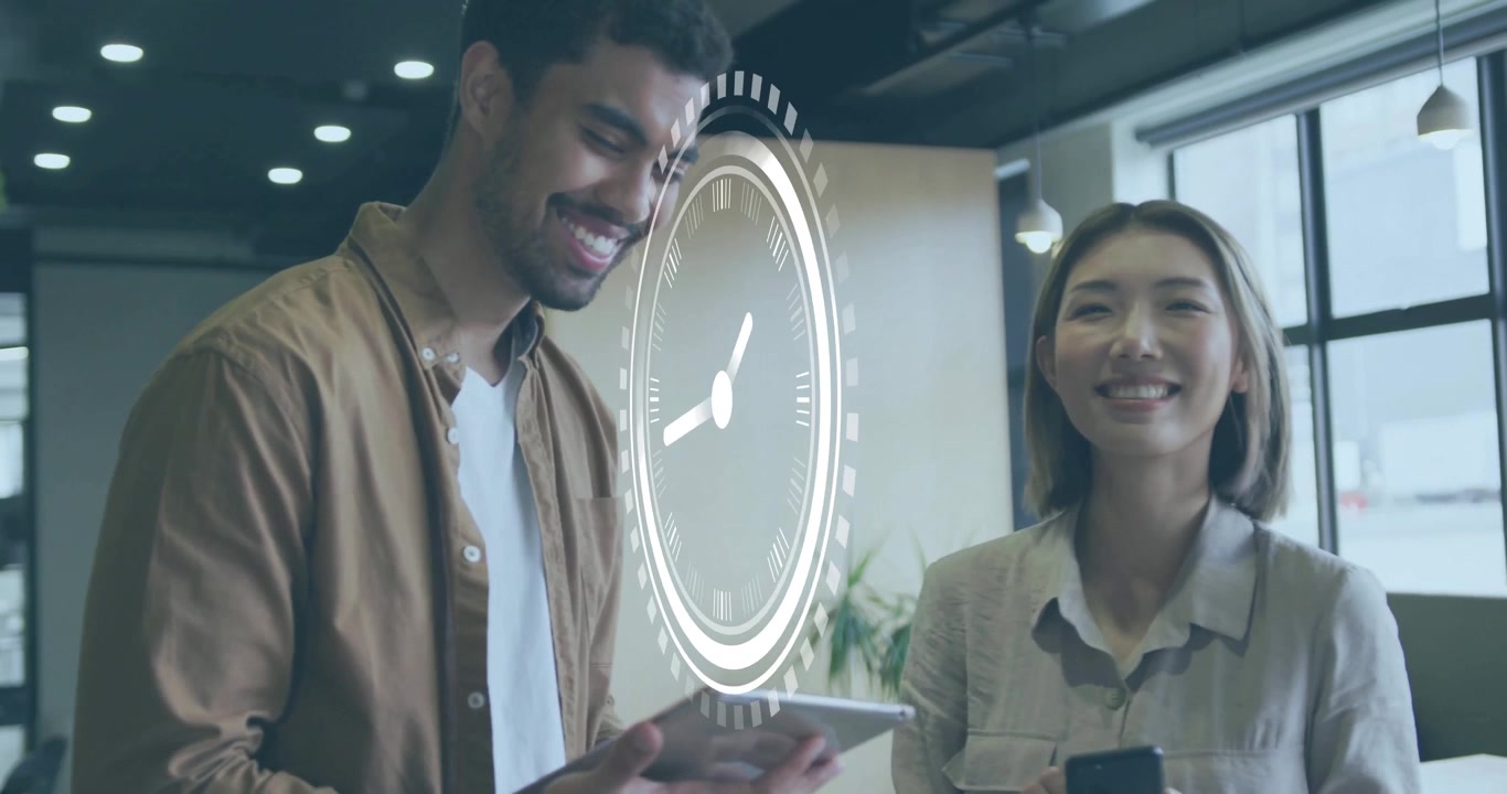 Team tapping tablet and scrolling phone in office starting fading clock icon animation for business