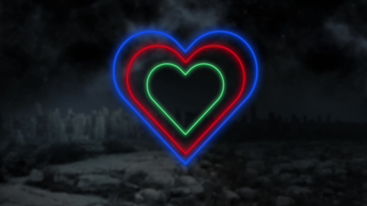 Animation of blue red and green concentric neon hearts flashing on a smoky black background